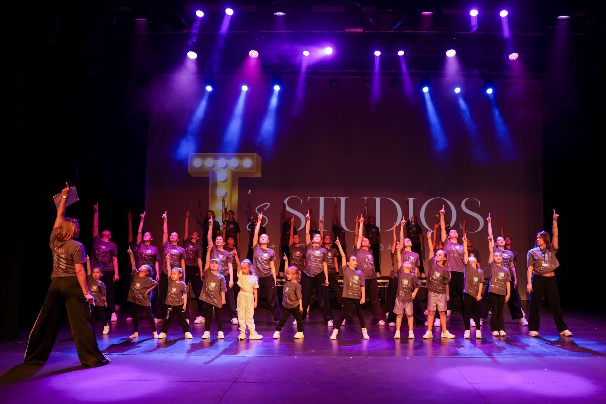 T's Studios dancers on stage in branded uniform tops